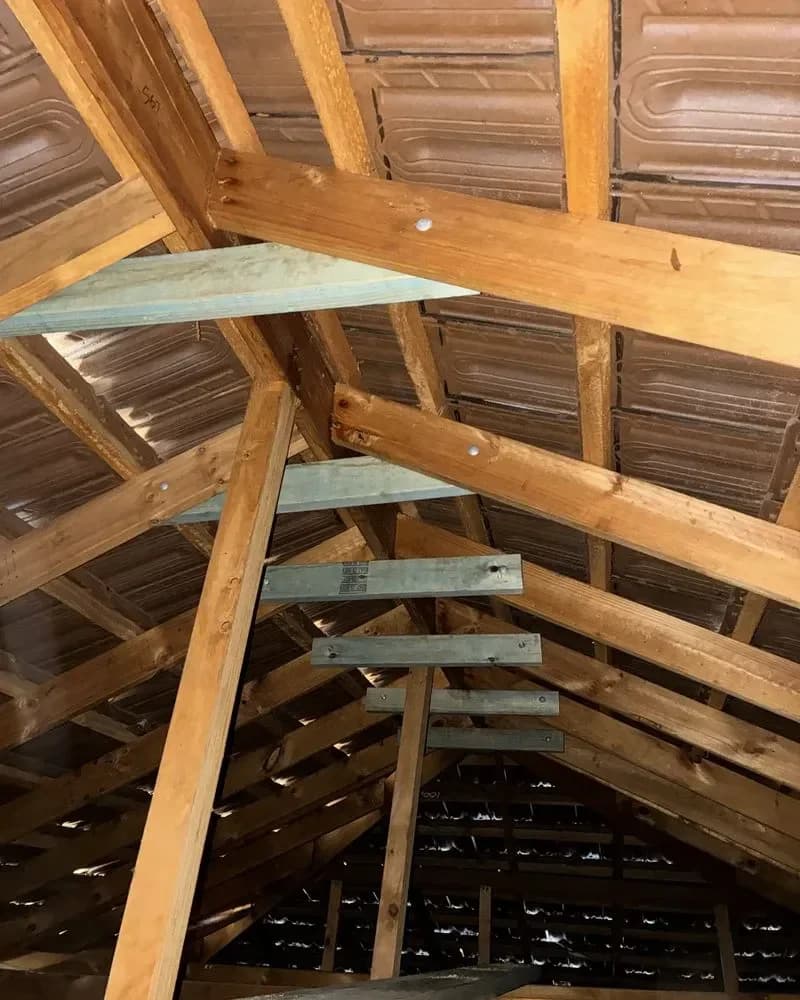 Roof timbers and strapping in a Perth roof cavity